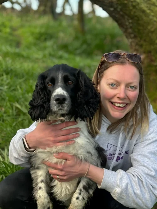 Dog Walker cuddling a dog